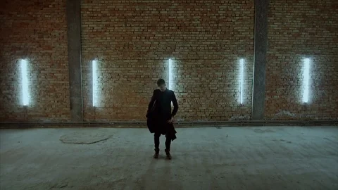 4K Stylish man in black dances in a garage. Feet art Stock-Footage 102829157