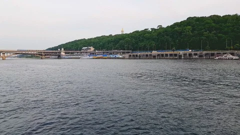 4K. Subway train rides over the bridge across the Dnieper River in Kiev Stock Footage 112651871
