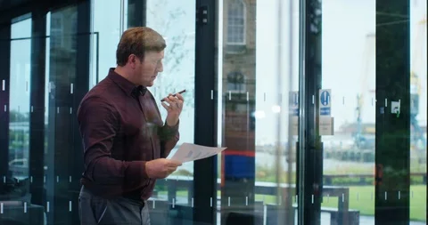 4K Successful business manager making conference call on phone in boardroom Stock Footage 118934428