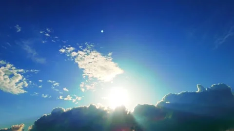4K Sun behind Clouds on Blue Sky Background Stock Footage 50346068
