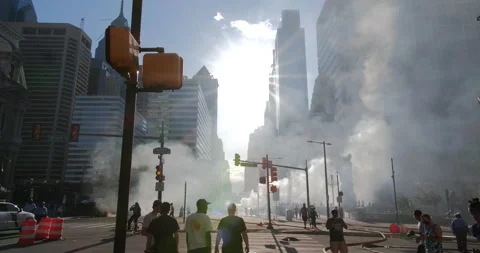 4K SUN SHINING THROUGH BUILDINGS WITH SMOKE FROM THE STREET Stock Footage 131456846