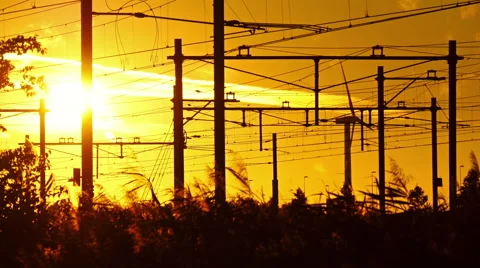 4k sundown clip when a inter-city train is crossing the railway.  Stock Footage 66496239