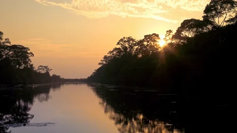 4K, Sunrise view up river from bridge leading to north gate at Angkor Thom.-Dan Stock Footage 119057255