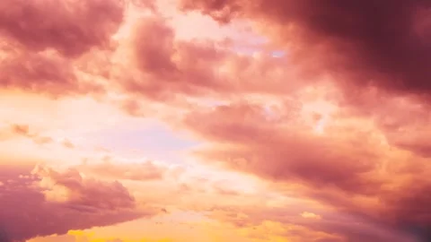 4K Sunset Cloudy Sky With Fluffy Clouds. Sunset Sky in pink orange colors Stock Footage 303710555