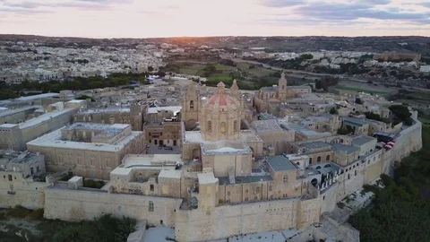 4k sunset drone - Ancient medieval fortress city of Mdina, Malta.  Old Capital Stock Footage 82847540