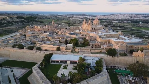 4k sunset drone - Ancient medieval fortress city of Mdina, Malta.  Old Capital Stock Footage 82847564