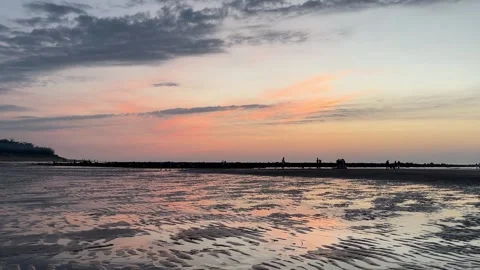 4K Sunset Glow over Tamsui Shalun Beach Ripples Stock Footage 334771357