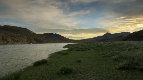 4K. Sunset on the Khovd river, Mongolian Altai, Mongolia. Ultra HD, 4096x2304 Stock Footage 73980265
