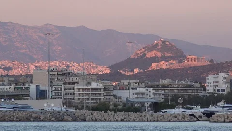 4K Sunset light over Acropolis temple and Athens cityscape Mount Lycabettus view Video stock 78715585