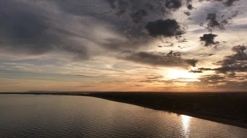 4K Sunset Loop Over Calm Lake With Dramatic Clouds And Golden Light Stock Footage 341865416