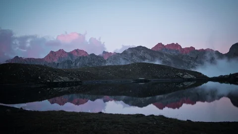 4k Sunset mountain peaks reflected in the lake Timelapse Stock Footage 87285976