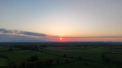 4K Sunset Over Open Farmland and Rural Horizon Stock Footage 333928635