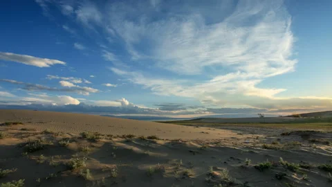 4K. Sunset over the Sands Mongol Els, Mongolia. Ultra HD, 4096x2304 Stock Footage 107023153
