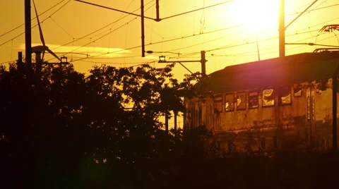 4k sunset reflected on a passing train. Stock Footage 66495386