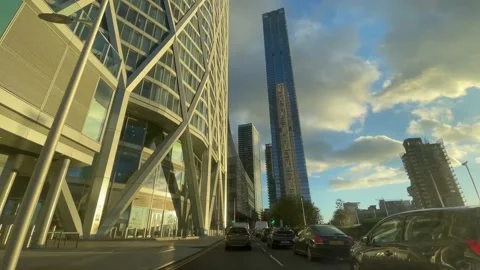 4K sunset reflection on approach to Marsh Wall roundable, Canary Wharf Stock Footage 221907378
