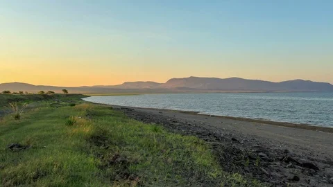 4K. Sunset, Spring flood in the river Yenisei. Mokhov village, Republic of Kh Stock Footage 76993321