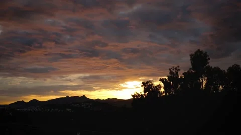 4k sunset timelapse in nature with cloudy sky Stockbeeldmateriaal 143980764