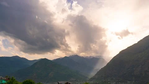 4K Sunset timelapse with sunbeams and clouds with mountain background as seen fr Stock Footage 340339050