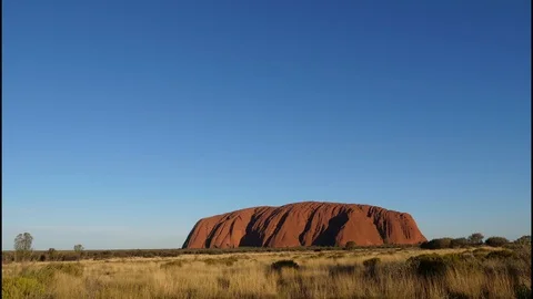 4K, sunset timelapse of a sunny day on Mount Uluru in Australia Stock Footage 106930671