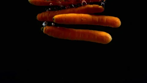 4K Super 1000 FPS Super Slow-Mo Of Carrots Splash Into Water Stock Footage 151389807