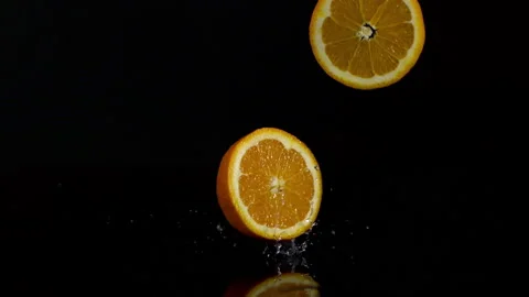 4K Super 1000 FPS Super Slow-Mo Of Oranges Falling On Black Ground Stock Footage 151532715