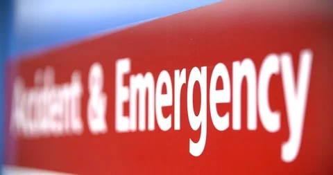 4k super shallow focus pull through accident and emergency sign outside hospital Stock Footage 98715974