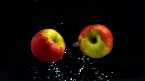 4K Super Slow-Mo Of Two Apples Floating In Water Stock Footage 151389566