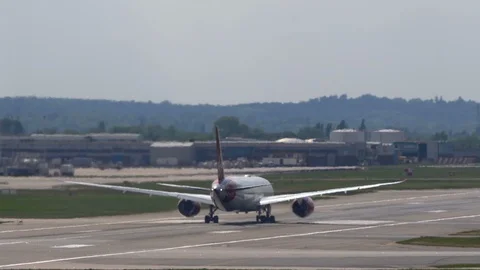 4k Super-telephoto plane accelerates down hot runway through heat shimmer  Stock Footage 112062901