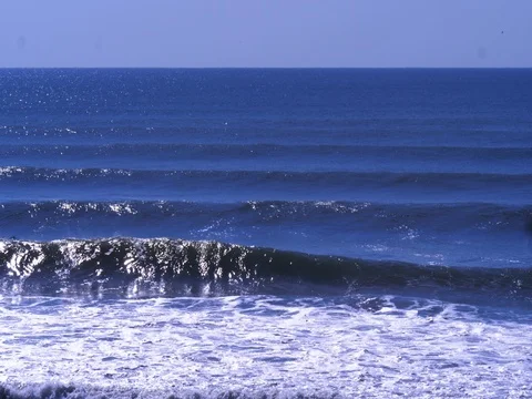 4k Surfers floating in ocean waves Stock Footage 80442775