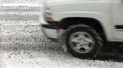 4K SUV drives through snow on the road Stock Footage 47527840