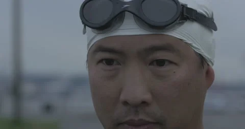 4k Swimmer puts goggles on Stock Footage 40274101