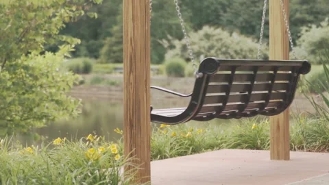 4K Swinging Bench in park Stock Footage 264790474