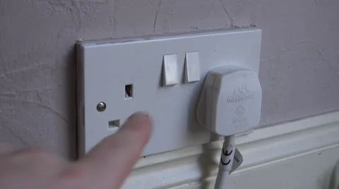 4k switching a plug on at home UK electrical sockets Stock Footage 47807399