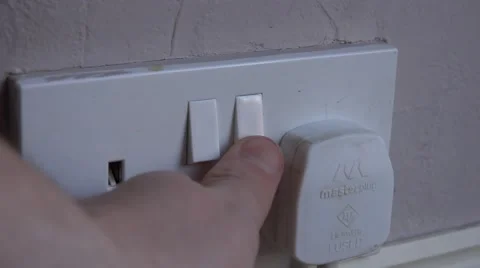4k switching a plug on at home UK electrical sockets Stock Footage 47807566