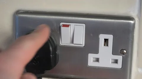 4k switching a plug off at home UK electrical sockets Stock Footage 47807858