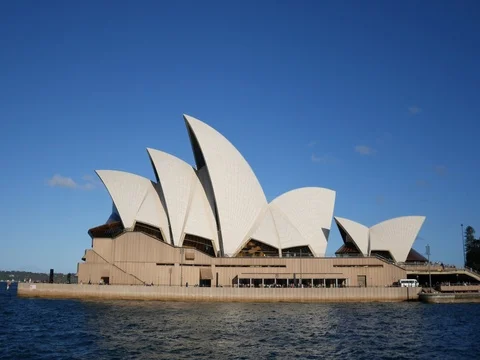 4k Sydney opera house during the day with blue sky Stock Footage 83473541