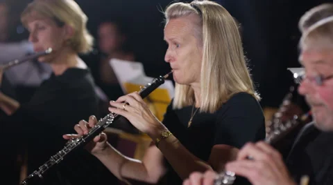 4K Symphony orchestra during a performance with focus on oboist Stock Footage 68677051