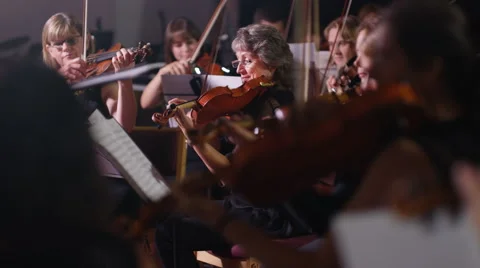 4K Symphony orchestra during a performance with focus on violinists Stock Footage 68678372