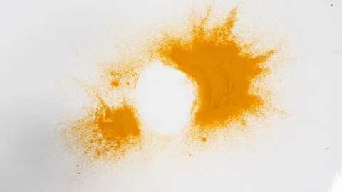 4K Taking Yellow Turmeric from pile spoon cup on white surface background herbs Stock Footage 88478651