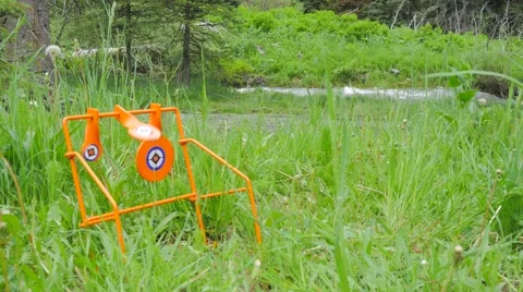 4k target pracctice hit mountain stream in background Stock Footage 64232942