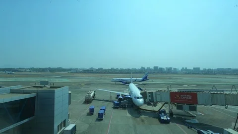 4K Tarmac Overview from the inside of Mumbai Airport's Terminal One, India. Stock Footage 126976972