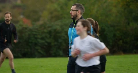 4K Team coach pointing &amp; shouting at his players at girls' soccer match Stock Footage 86311854