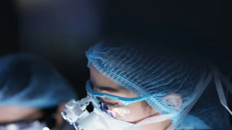 4K Team of surgeons in operating theater performing operation on a patient. Stock Footage 63032751