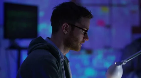 4K Team of young computer hackers trying to gain access to a computer system Stock Footage 60937722