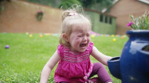 4K Tears & tantrums - Portrait of little girl crying in the garden Stock Footage
