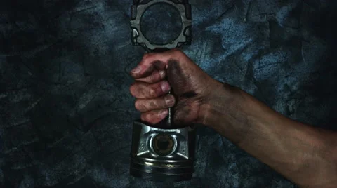 4k Technical Composition of Dirty Mechanic Hands Holding Piston Stock Footage 66687360