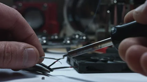 4k technical composition of human hands soldering wires Stock Footage 64766464