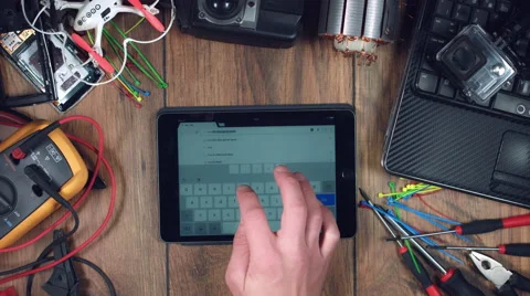 4k Technology Composition from Above of Hand writing on iPad 'How to' Stock Footage