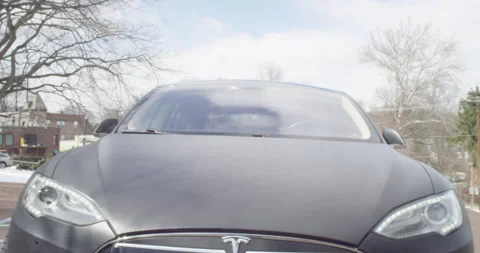 4k Tesla Model S Front logo dolly out to front of car parked Video stock 137612033