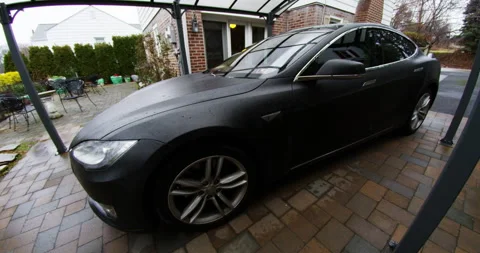 4k Tesla model S side shot in driveway Stock Footage 137619767